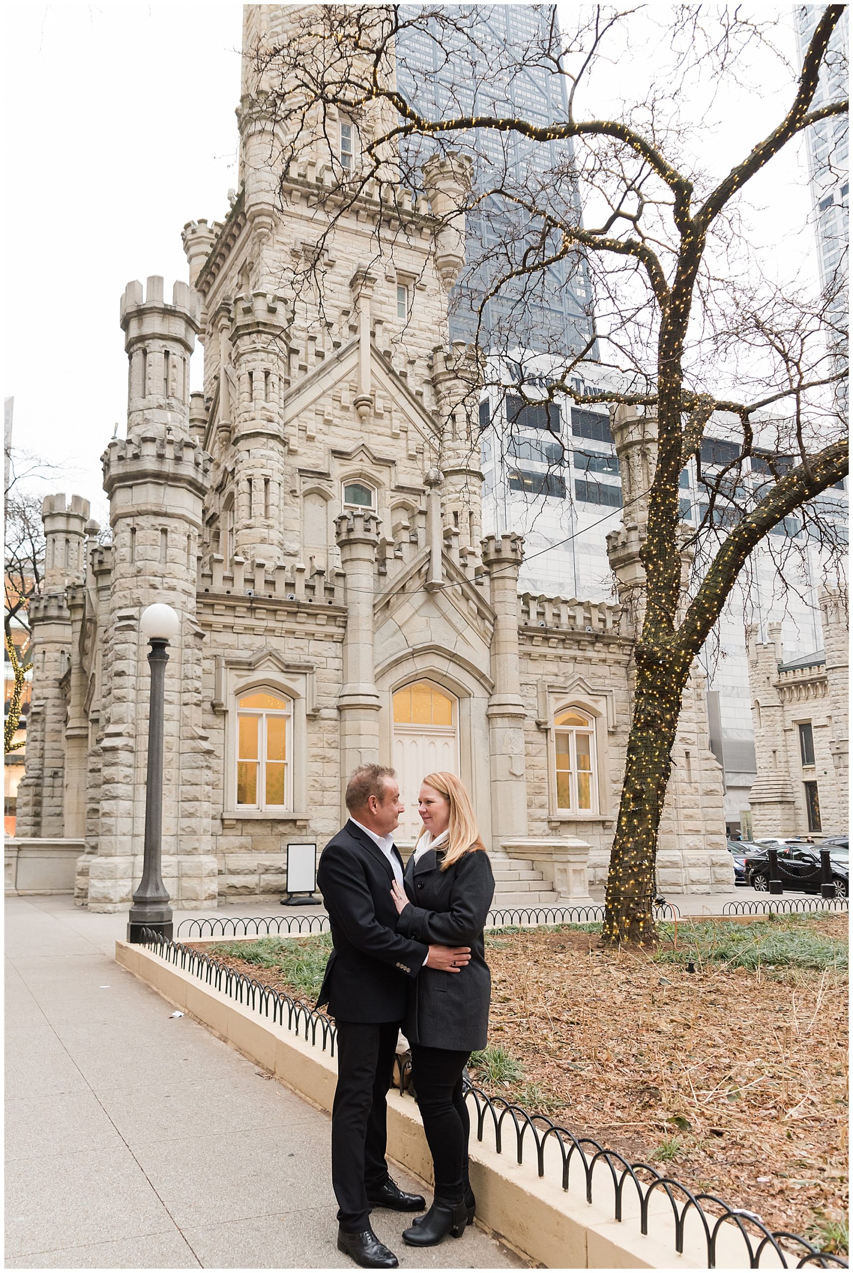 Engaged couple outside Water Tower in Chicago