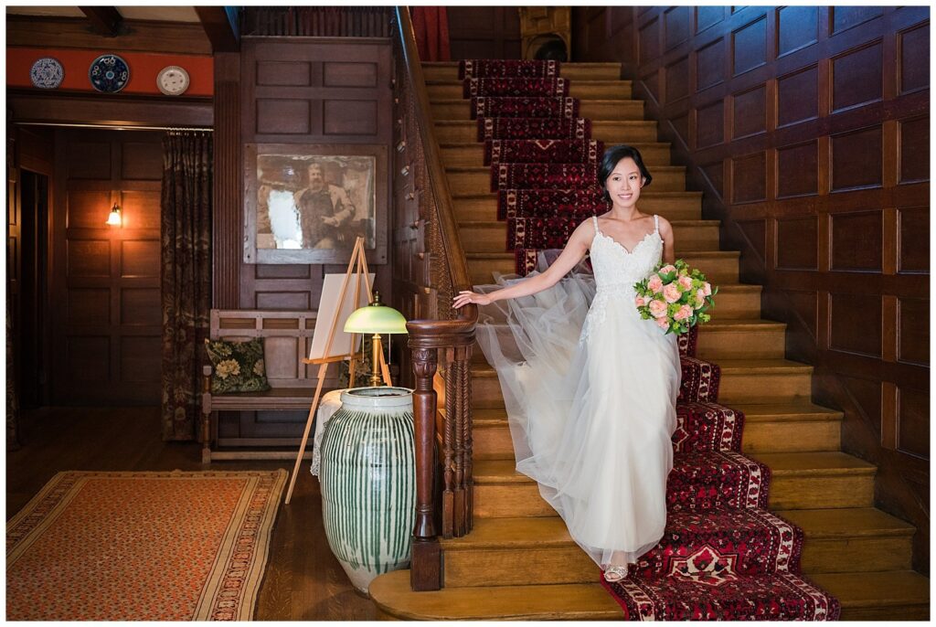 Bride walking down a wooden staircase before her wedding at Glessner House Chicago