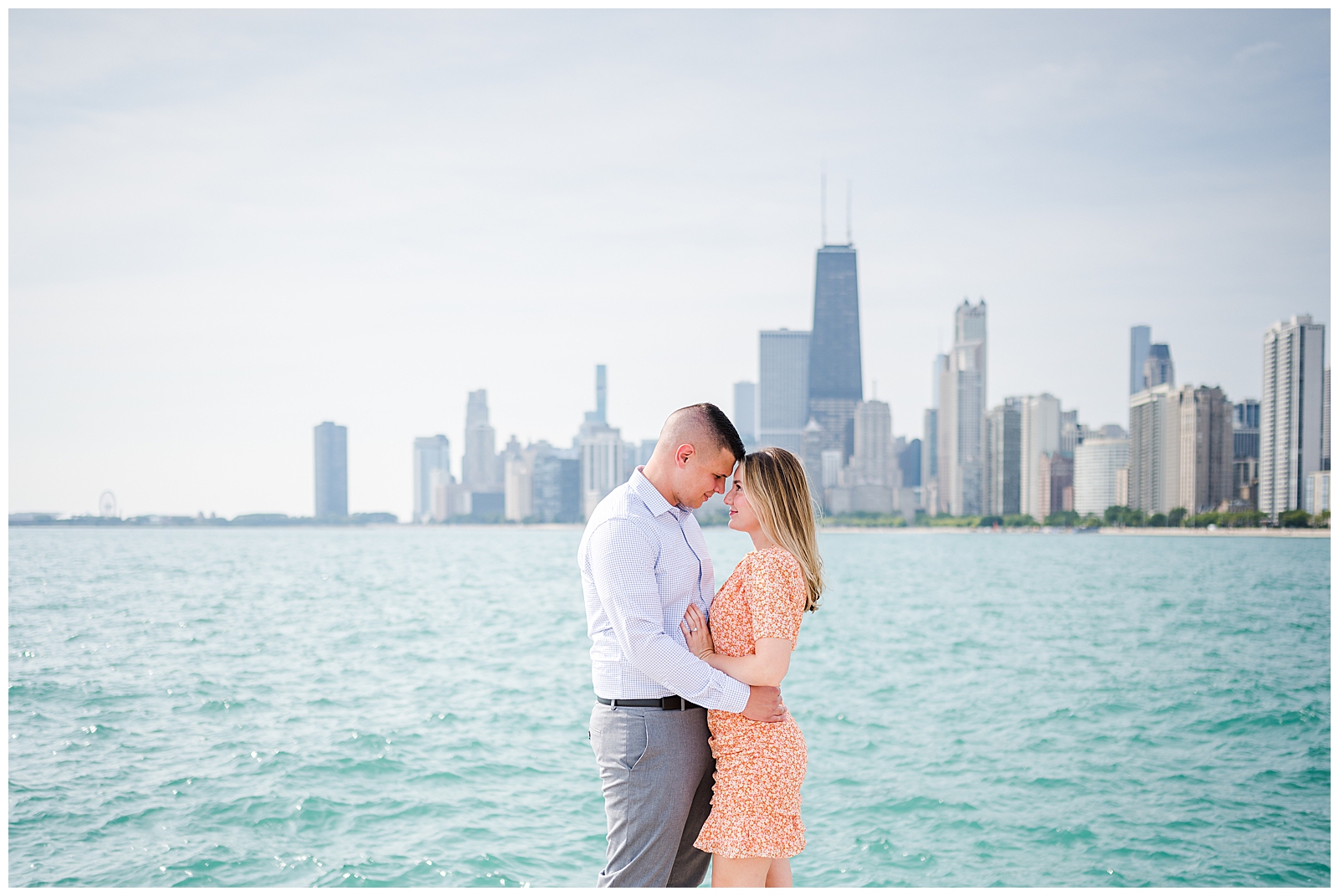 Engagement session at North Ave beach overlooking the Chicago skyline and Lake Michigan.